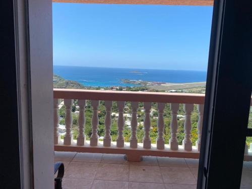 a view of the ocean from a balcony at The Pink House, Saint Thomas, Ocean View in Contant