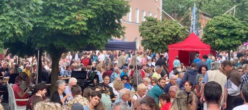 a large crowd of people standing around a red tent at Silberwurz in Bad Reichenhall
