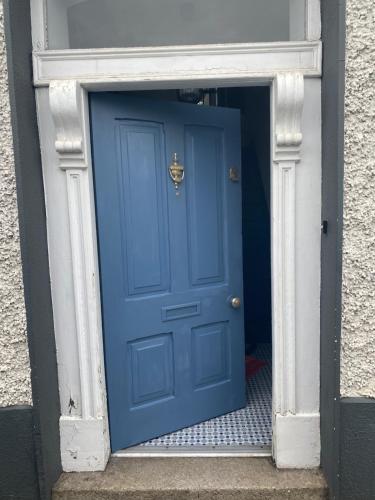 a blue door in a doorway in a building at No1 The Townhouse Kildare in Kildare