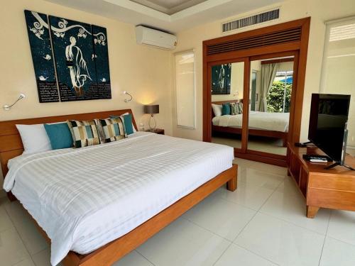 Postel nebo postele na pokoji v ubytování Private Villa mit eigenem Pool in einem Villen Resort in Plai Leam