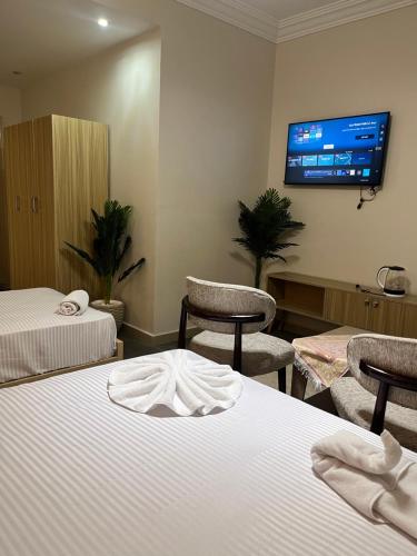 Postel nebo postele na pokoji v ubytování Triple garden view hotel