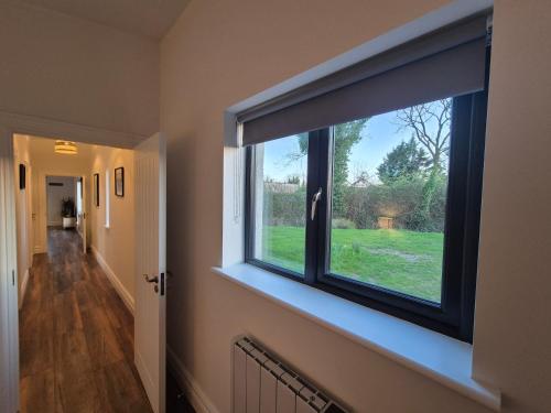 a large window in a room with a hallway at The Lodge in Mullingar