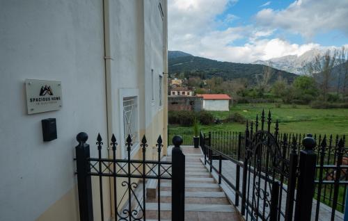 a staircase leading to a house with a fence at Spacious home in Klitoria
