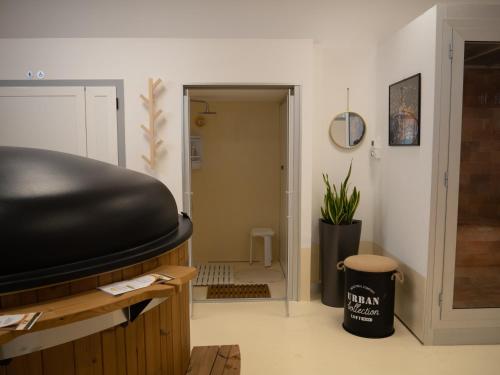 a room with a large black object in a room at Il Poggio degli Antichi Sapori - Residence in Paternopoli