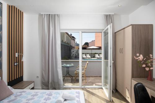 Ένα ή περισσότερα κρεβάτια σε δωμάτιο στο Apartmant & rooms Villa Rosa Medulin
