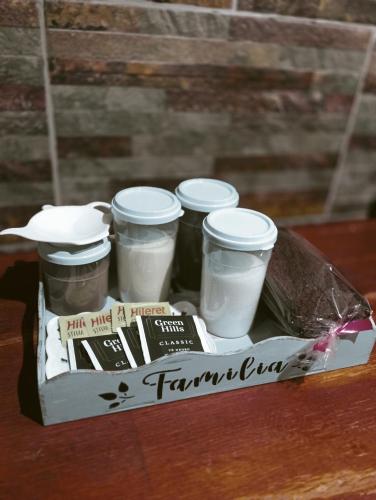 a tray of four jars of food on a table at Alquiler por día en Cutral Có in Eva Perón