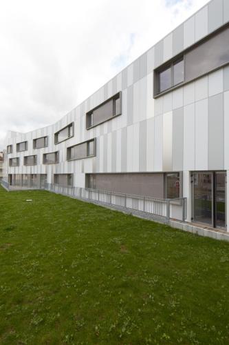 an office building with a green lawn in front of it at Campanile Annemasse Gare– Genève in Annemasse