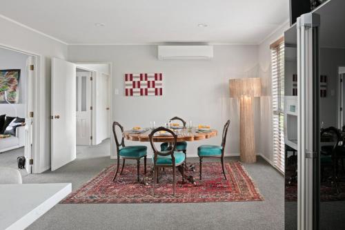 a dining room with a table and chairs at NEW - Farm House Near Town! in Gisborne