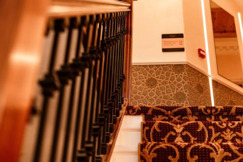 a set of stairs in a building with a rug at Domo Boutique Hotel Birmingham in Birmingham