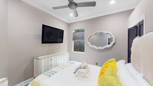 a bedroom with a bed and a ceiling fan at The Riverview Estates Sauna And Heated Pool in Riverview