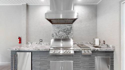 a kitchen with a stove and a counter top at The Riverview Estates Sauna And Heated Pool in Riverview