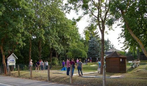 a group of people walking around a park at HANSA Hotel in Mendig