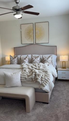 a bedroom with a white bed with a white blanket at Atlanta Beltline Luxury Double Suite in Atlanta
