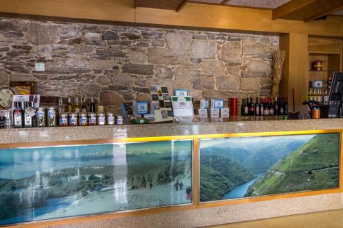 a bar with a view of a mountain at Hotel Casa de Caldelas in Castro Caldelas