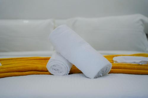 two rolls of toilet paper on top of a bed at RIAD REDWAN in Marrakech