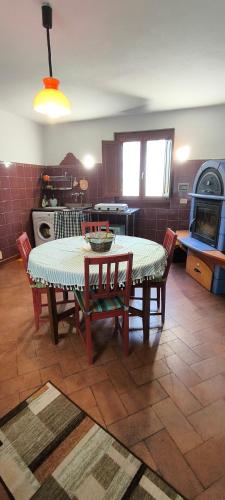 a kitchen with a table and chairs in a room at Artenatura BeB in Terranuova Bracciolini