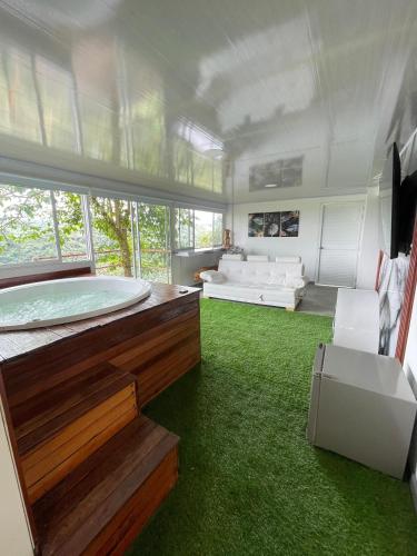 a large room with a large tub in a house at Glamping La Reserva in Pereira