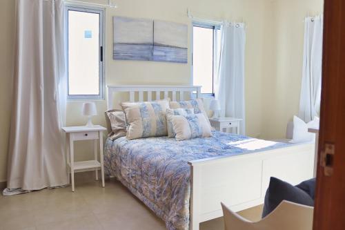 Ένα ή περισσότερα κρεβάτια σε δωμάτιο στο Charming TSI Punta Cana with Spacious Interior