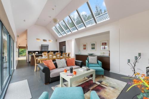 a living room with a couch and a table at Lakeview Callow near Foxford, Swinford and Westport in Foxford