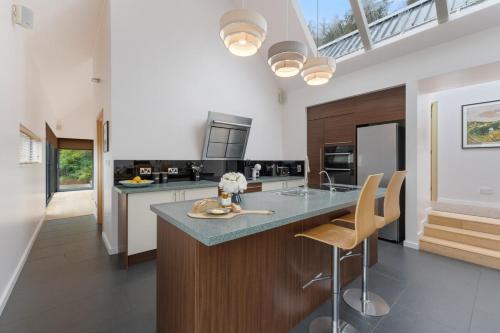 a kitchen with a island with a counter top at Lakeview Callow near Foxford, Swinford and Westport in Foxford