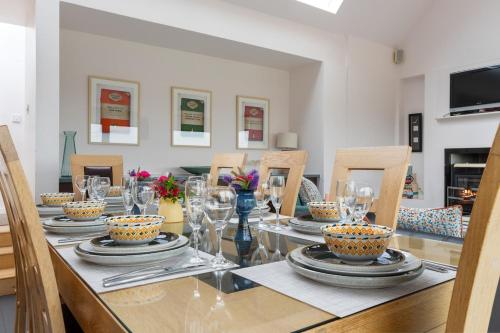 a dining room with a glass table and chairs at Lakeview Callow near Foxford, Swinford and Westport in Foxford