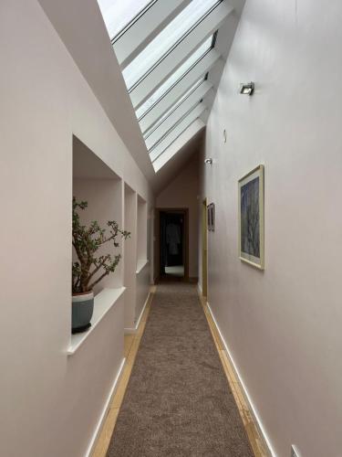 a hallway with a skylight in a house at Lakeview Callow near Foxford, Swinford and Westport in Foxford
