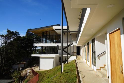 an external view of a building with a spiral staircase at Hotel con Corazon Monteverde in Monteverde Costa Rica