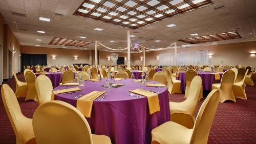 a banquet hall with purple tables and chairs at Best Western Plus Brandywine Inn & Suites in Monticello
