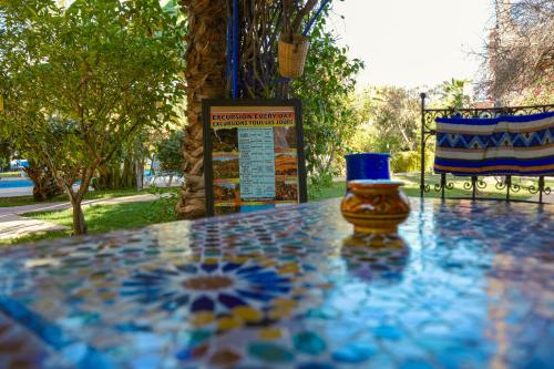a glass vase sitting on top of a table at RIAD REDWAN in Marrakech