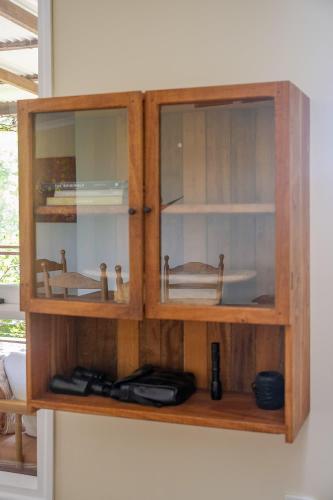 a wooden cabinet hanging on a wall at Family-Friendly Hinterland Stay l Nova Escapes in Dorroughby