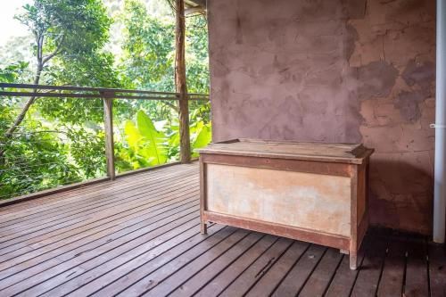 an empty room with a wooden deck with a window at Family-Friendly Hinterland Stay l Nova Escapes in Dorroughby