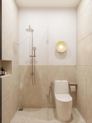 a bathroom with a toilet and a shower at 68 Hotel Go Cong in Gò Công