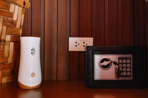 an ipod and an alarm clock on a table at The Dome Hotel - Caylabne Bay in Ternate