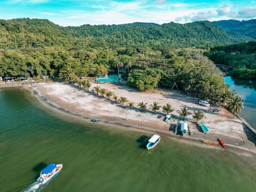 an aerial view of a beach with boats in the water at The Dome Hotel - Caylabne Bay in Ternate