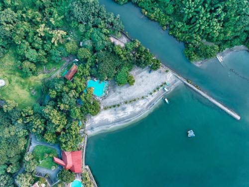 an aerial view of a river with trees and water at The Dome Hotel - Caylabne Bay in Ternate