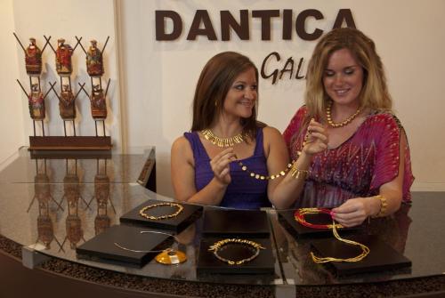 two women standing in front of a table with jewelry at Dantica Cloud Forest Lodge in San Gerardo de Dota