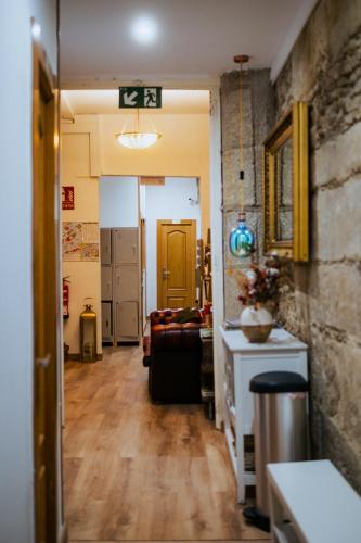 a hallway of a room with a living room at Hostal Santa Cruz in Santiago de Compostela
