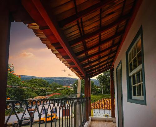 a balcony of a house with a view at Hospedagem Central in Tiradentes