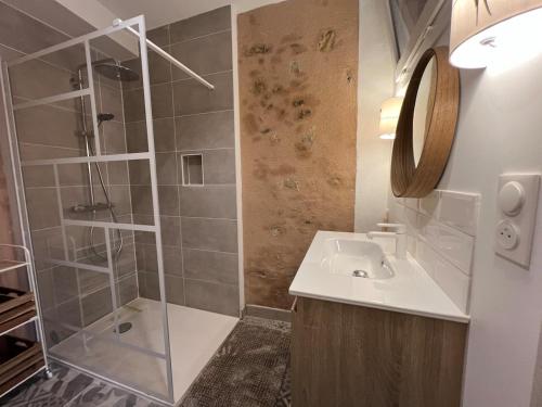 a bathroom with a shower and a sink at La bâtisse de Coustouge in Coustouge