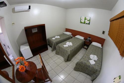 Ένα ή περισσότερα κρεβάτια σε δωμάτιο στο Hotel Poyares