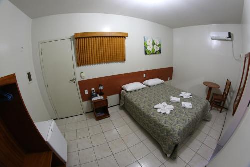 Ένα ή περισσότερα κρεβάτια σε δωμάτιο στο Hotel Poyares