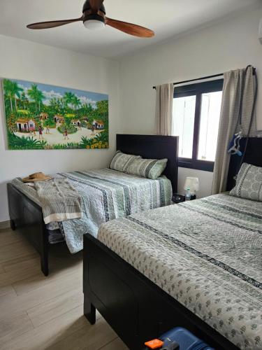 Llit o llits en una habitació de Las Terrenas Paradise