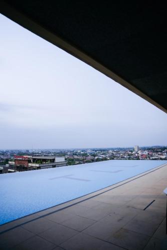 a large window in a building with a view of a city at Ramada by Wyndham Vientiane Central in Vientiane
