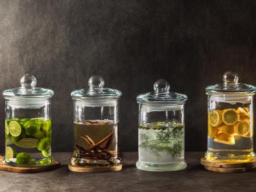 four glass jars filled with different types of liquids at Grand Mercure Nara Kashihara in Kashihara