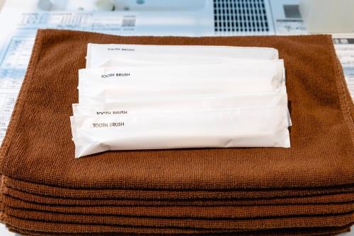 a stack of paper towels sitting on top of a table at Amp flat HEC 02 in Muromimachi