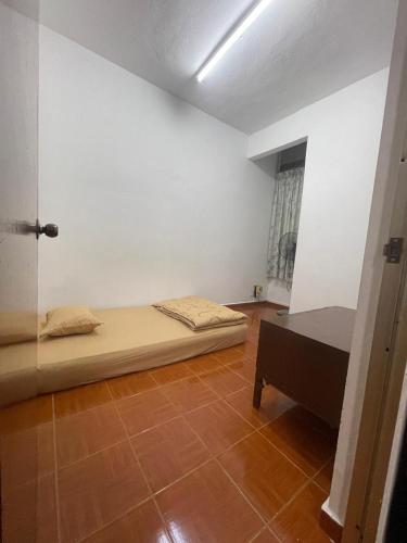 Ένα ή περισσότερα κρεβάτια σε δωμάτιο στο PD Perdana Homestay 3BR