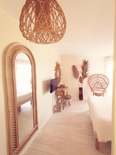 a bedroom with a large mirror and a bed at Hotel Tennis International in Cap d'Agde
