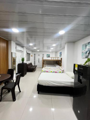 Giường trong phòng chung tại ESTRELLA DEL MAR