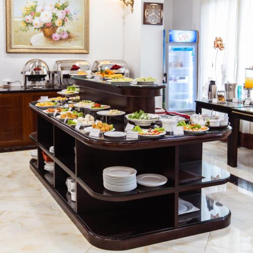 a buffet line with many different food items on it at A25 Hotel - 15 Trần Quốc Toản in Hanoi