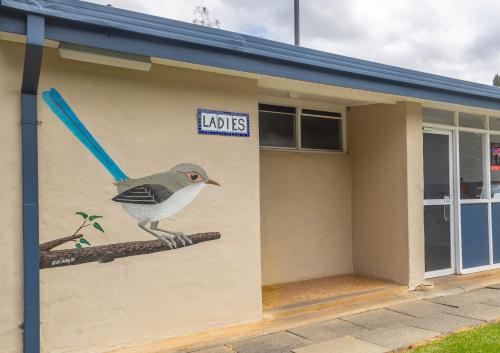 a painting of a bird on the side of a building at BIG4 Bridgetown in Bridgetown